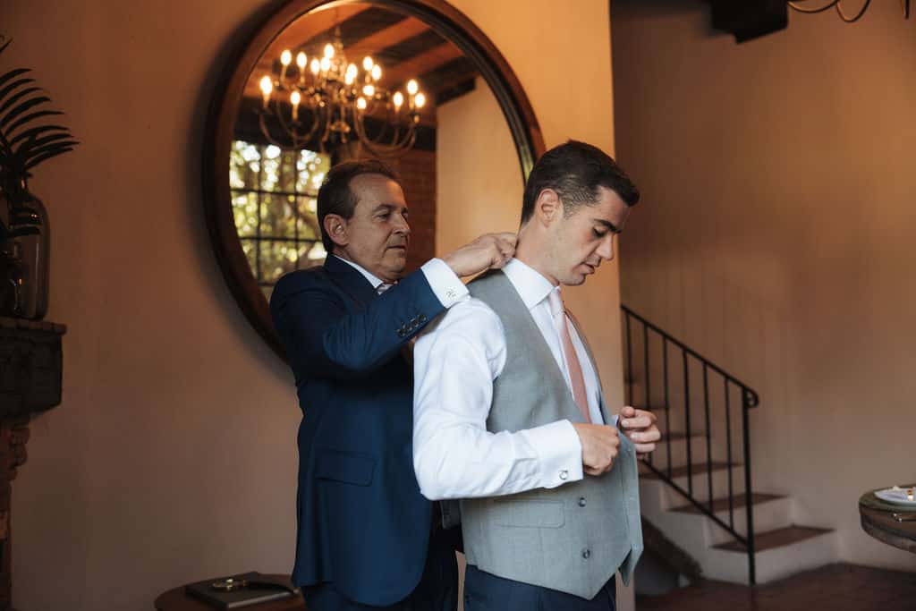 Groom getting ready with his father in the Groom's House