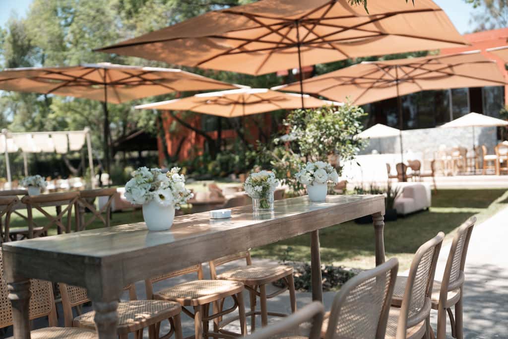 Garden table with white floral arrangements