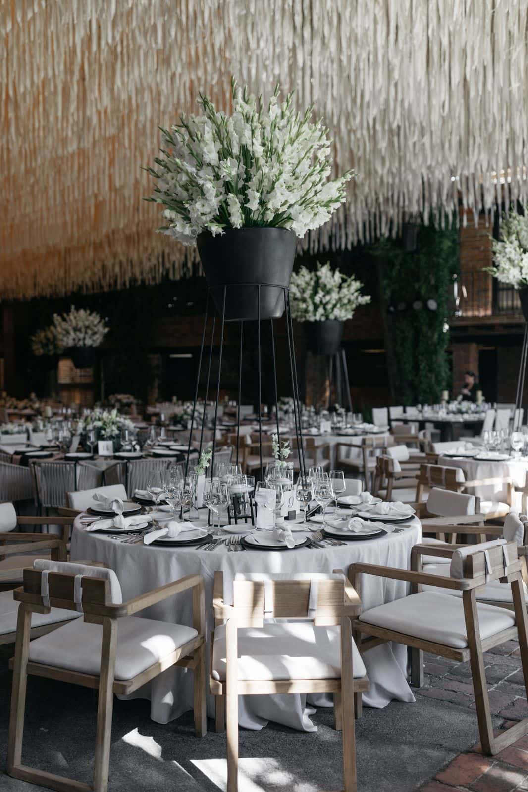 Round table with tall floral arrangement in the Main Hall