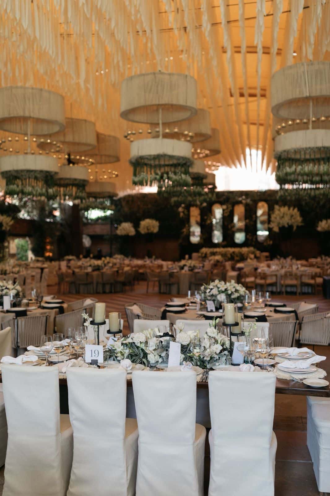 Long table with chandeliers and decorated ceiling in the Main Hall