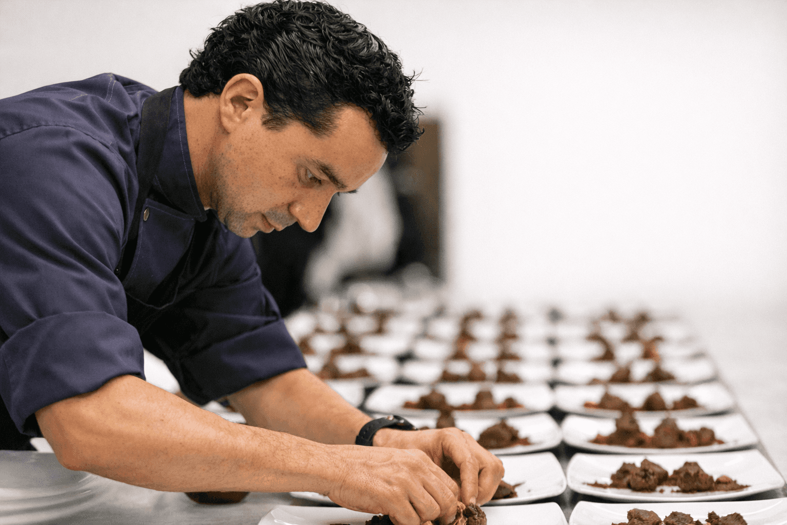 Santi Palacio plating during corporate event service